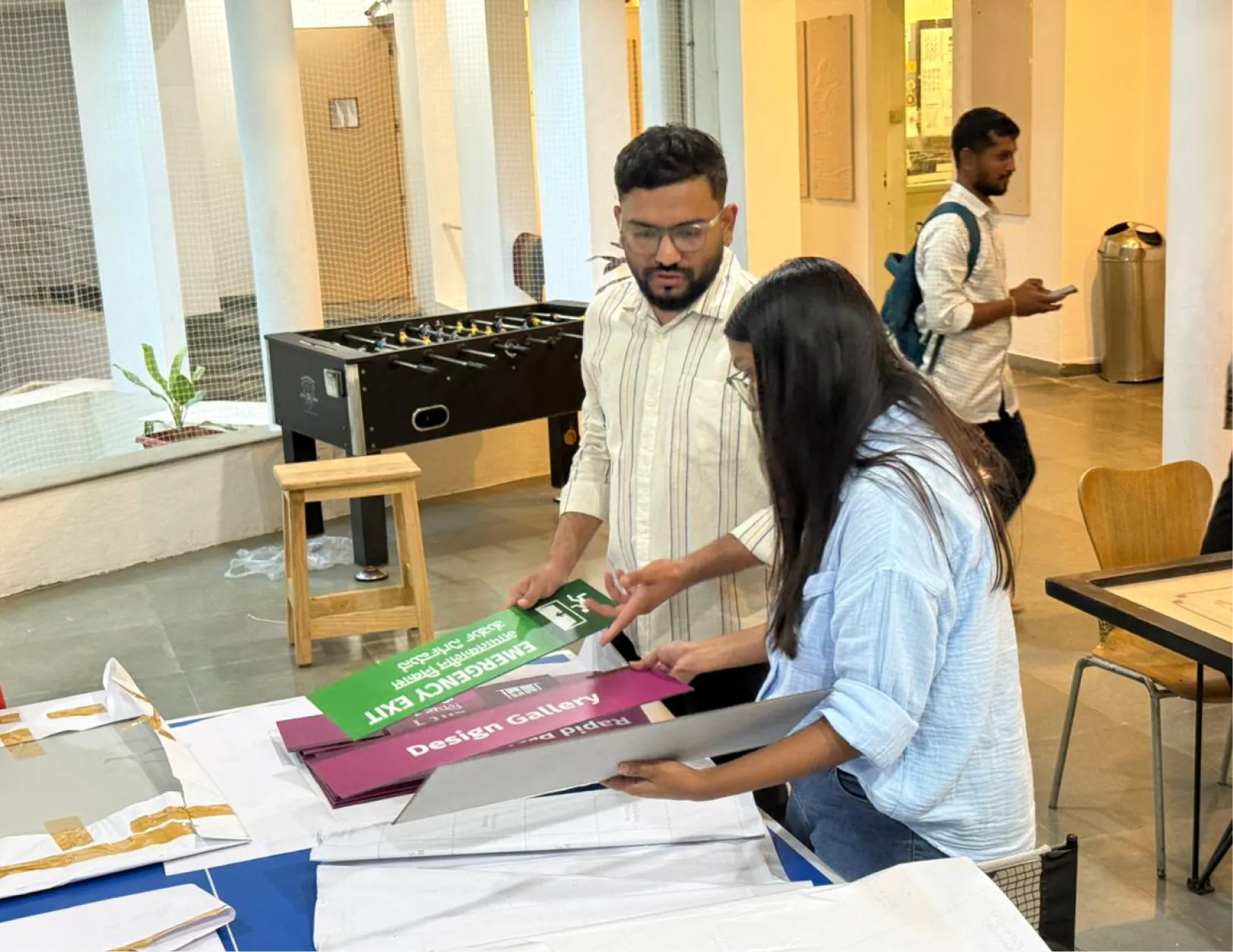 Team laying out signs on a table